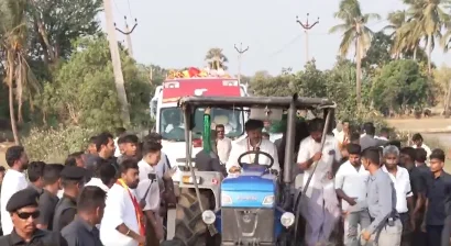 TN CM Vijay drives tractor on farm fields, seeks votes in Madurantakam